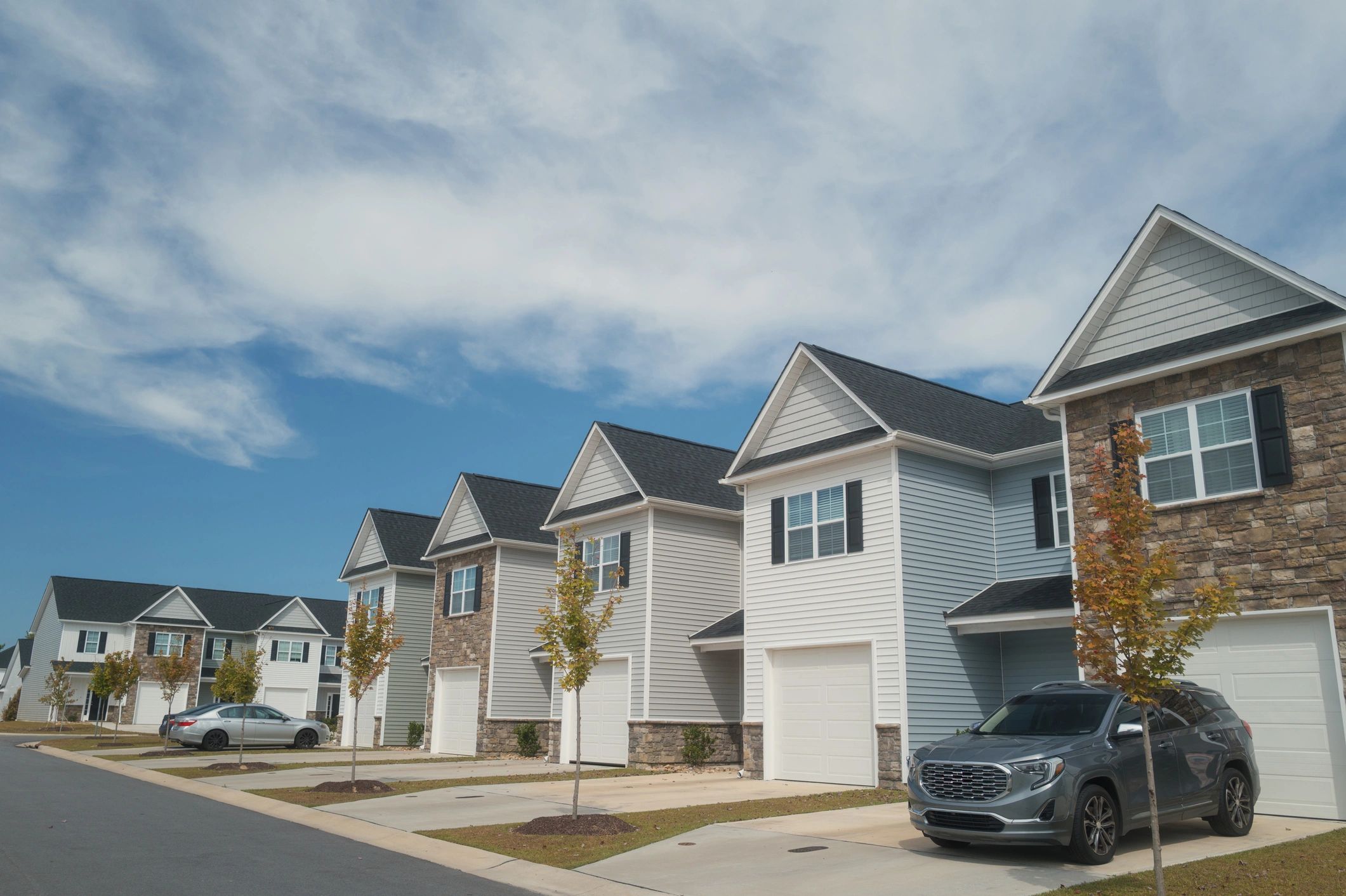 Residential sidewalk in front of townhomes